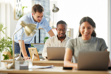 Laptop, coaching and business people in office, planning for budget and financial report for audit. Group, mentor or employees in workplace, pc or bookkeeping with profit growth or company compliance