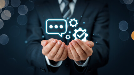 Business man holding digital icons representing communication and automation