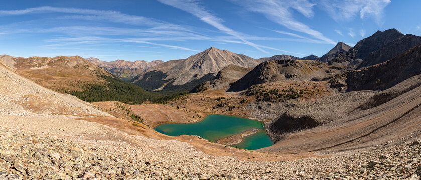 A scenic autumn panorama captures Lake Ann on the Continental Divide in Colorado's Sawatch Range, with 14er Huron Peak and several notable 13ers rising behind it.