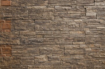 Obraz premium Textured wallpaper featuring flagstone wall panels with natural stone cladding