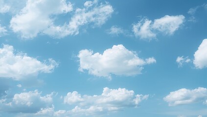 Obraz premium Puffy white clouds drifting across a clear azure sky, evoking a calm and invigorating scene for weather and nature concepts