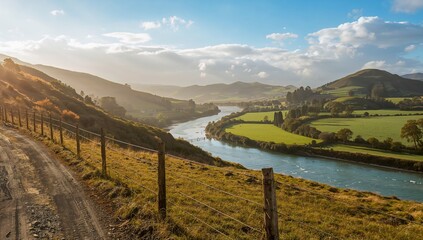 Farm valley river with dirt path and fence on hillside