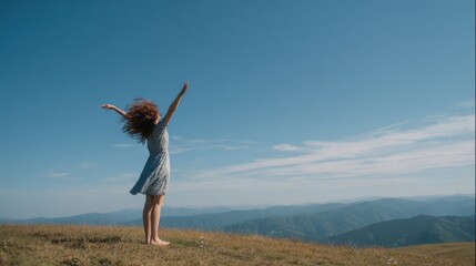 Fototapeta premium Woman Embracing Freedom On Mountain Peak Under Clear Blue Sky. Symbol Of Liberation And Connection With Nature