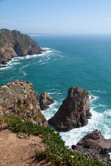 Vertical shoot breathtaking panorama of Cabo da Roca, Prtugal. European westernmost point, dramatic cliffs. Travel tourism. The vast atlantic ocean trip. Wallpaper background. Copy space