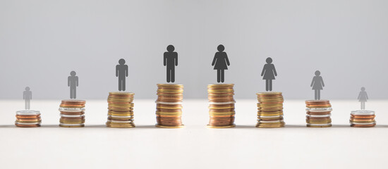 Coins with a Gender pay gap inequality concept.