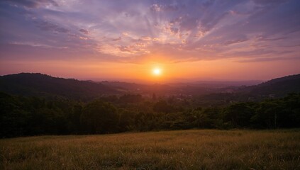 Obraz premium Stunning evening glow over a natural landscape with vibrant sky and sunlight