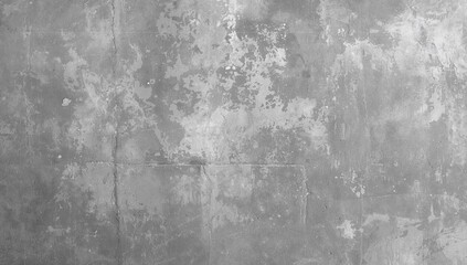 Detailed view of an aged concrete surface featuring irregular patterns and varied gray hues with white spots and darker areas.