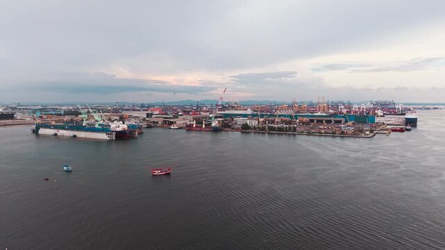 Aerial view shipping port boat with crane transport industry