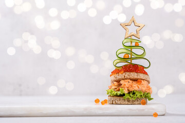 Christmas tree canape with Smoked Salmon and red caviar