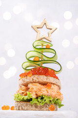 Christmas tree canape with Smoked Salmon and red caviar
