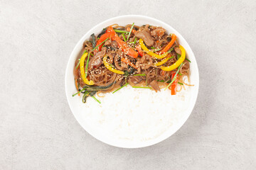 Japchae is a dish made by stir-frying vegetables, mushrooms, meat, and other ingredients and mixing them with boiled glass noodles.
