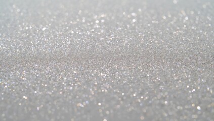 Detailed view of a silver background sprinkled with sparkles