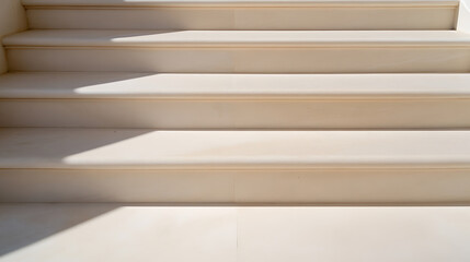 Fototapeta premium Elegant steps bathed in sunlight create a sense of depth and minimalist beauty, highlighting architectural design with a soft, neutral palette.