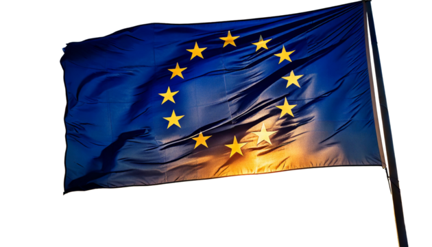 The flag of the european union, with its circle of stars, waving against a sunset white