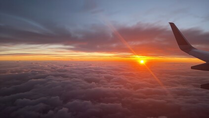 Stunning evening sky filled with clouds and vibrant light. Airplane cabin perspective.