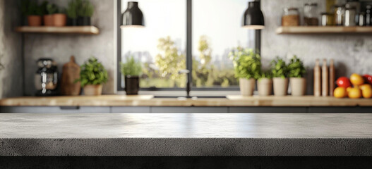 Fototapeta premium A contemporary kitchen space prominently features a raw concrete counter, with blurry elements like greenery, shelves, and a bright window.