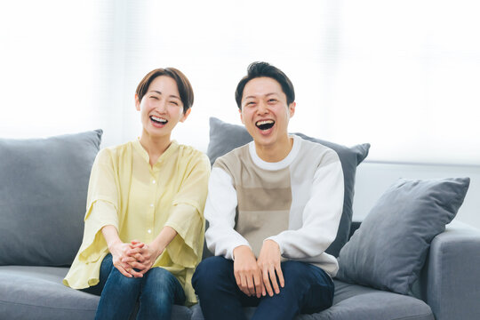 A middle-aged couple relaxing in the living room