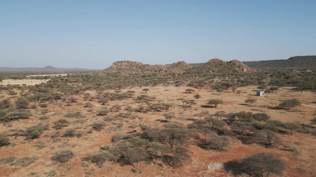 aerial view, African landscape typical Southern African region ,mountain range, savannah bush with acacia trees, shrubs and sand