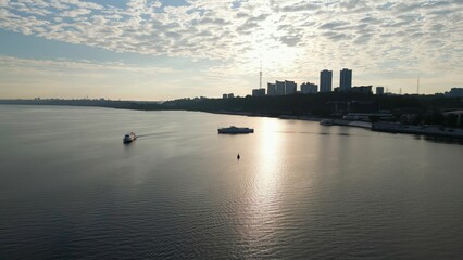 Passenger ferry approaching another ferry on dnipro river at sunrise. Clip