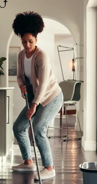 Dance, cleaning and woman mop floor for hygiene maintenance, housework and home sanitation. Music, chores and happy African person with disinfection, bacteria safety and housekeeping in kitchen