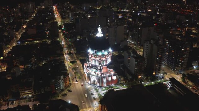 Drone view of a church in Lima, Peru. In the district of Magdalena del mar Drone orbits around the dome with statue of virgin mary