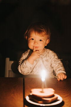 Portrait of cute child celebrating birthday at home