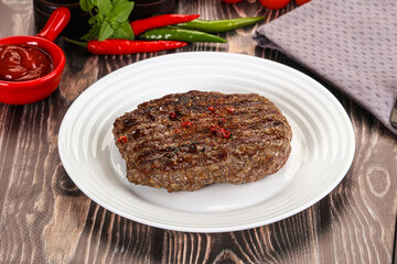 Grilled beef burger cutlet with sauce