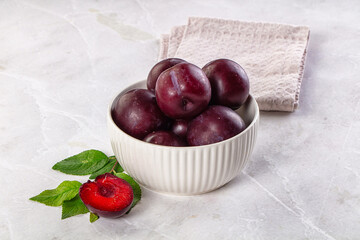 Raw ripe purple plum heap