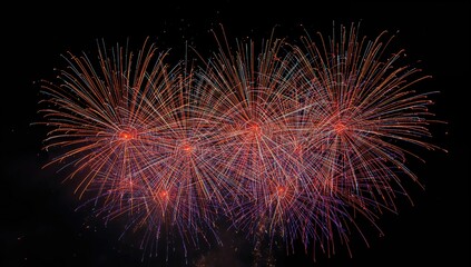 Fototapeta premium Vibrant fireworks display lighting up the dark night sky
