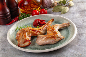 Roasted rabbit leg served rosemary
