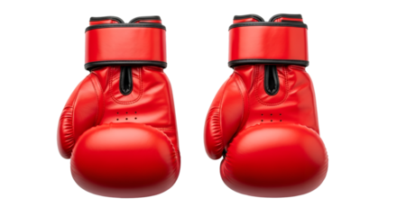 A pair of vibrant red boxing gloves ready for the fight embodying strength and determination against a stark black