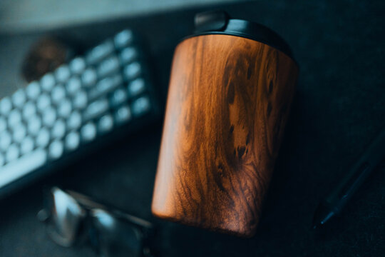 
Thermo cup on desk at workplace
