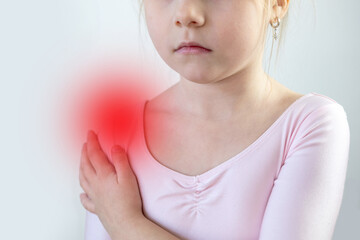 Child with painful arm injury, little Five year old girl holding injured arm, shoulder, swelling, bruise, fracture risk, joint pain, rheumatism, medical care, pediatric healthcare