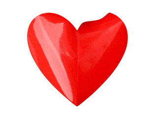 A glossy red heart shape, with a small section missing from the top right edge, against black