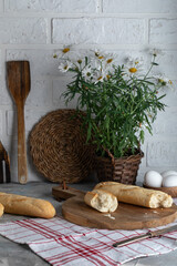Fresh baguettes on a village table in the morning