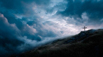 A solitary cross stands on a rocky hilltop against a dramatic cloud filled sky