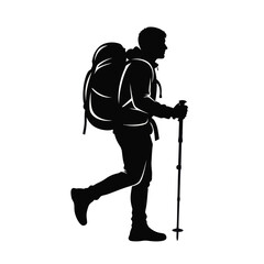 Backpacker with large rucksack and trekking poles a dramatic silhouette