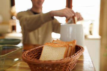 man making toasts with toaster for morning breakfast, Focus Bread