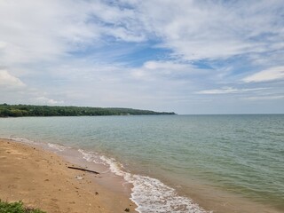 Beach scene on what appears to be slightly overcast but still bright day.