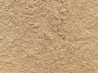 Rough beige wall texture, perfect for background or surface design.