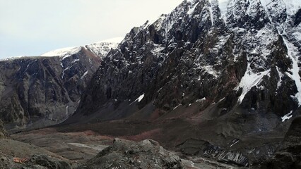 Majestic mountain range looms over expansive valley. Media