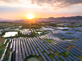 Aerial views of solar farms with mountains in the distance © zhu difeng