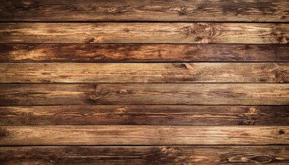 Naklejka premium The image shows a close-up view of multiple horizontal dark brown wooden planks arranged side by side, showcasing the wood grain and texture.
