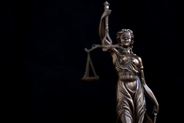 Obraz premium Lady Justice statue in law on black background. Law and justice concept