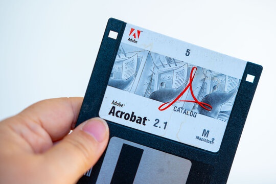 Vintage 3.5 inch floppy disk Adobe Acrobat 2.1, Macintosh version computing, digital history, software tech artifact, retro tech nostalgia, analog and digital storage, old school computing history