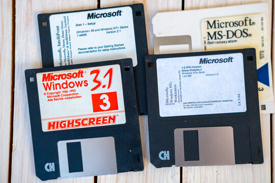 Vintage Microsoft floppy disks for Windows 3.1, MS-DOS, retro computer software installation media, early PC technology, data storage and digital nostalgia, information storage, old school technology