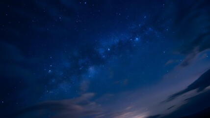 A background of a clear night sky full of stars.