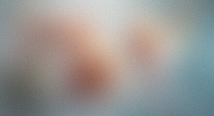 Soft focus abstract background with warm, glowing hues and cool, diffused light.
