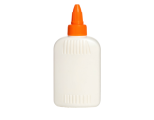 Close-up of a plastic, white glue bottle with an orange cap against a black background