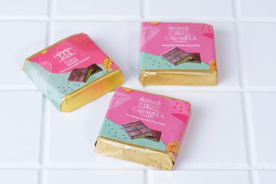 Subang,West Java,Indonesia on September 11,2025.Close up of Dubai chocolate bar with colorful packaging on white background, luxury confectionery product for advertising and branding.